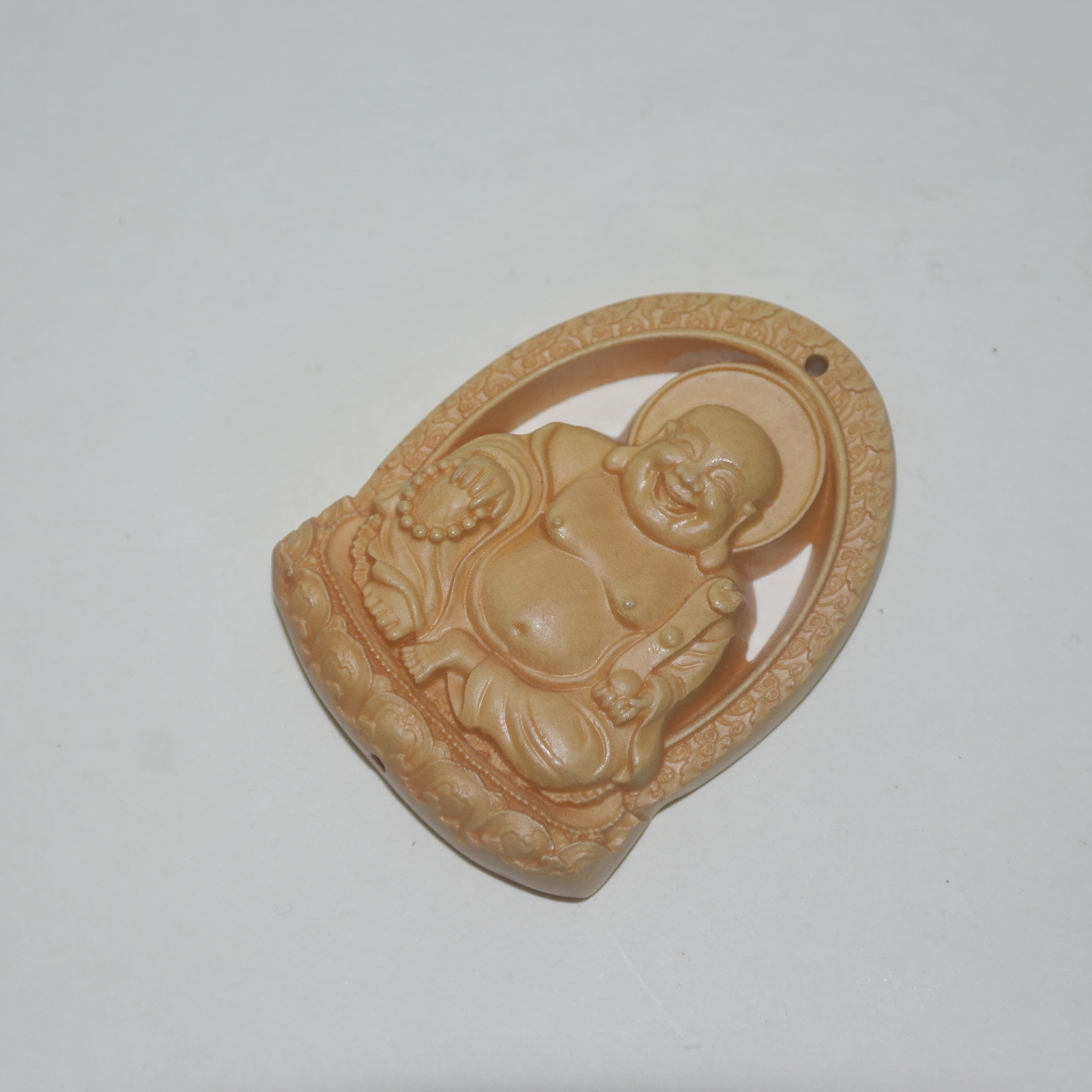 회양목나무에 포대화상이 조각된 패