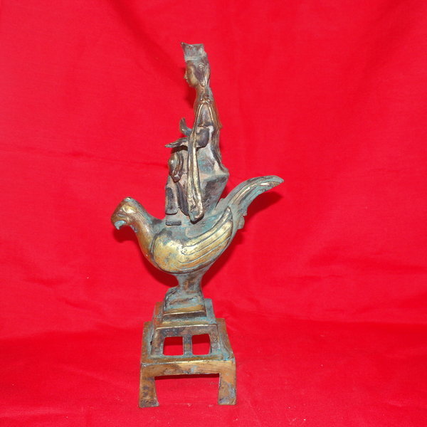 청동으로된 비익조를탄 금동불